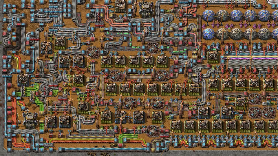 Factorio factory build showing dense belt and assembler network with blue science production - Factorio gameplay screenshot